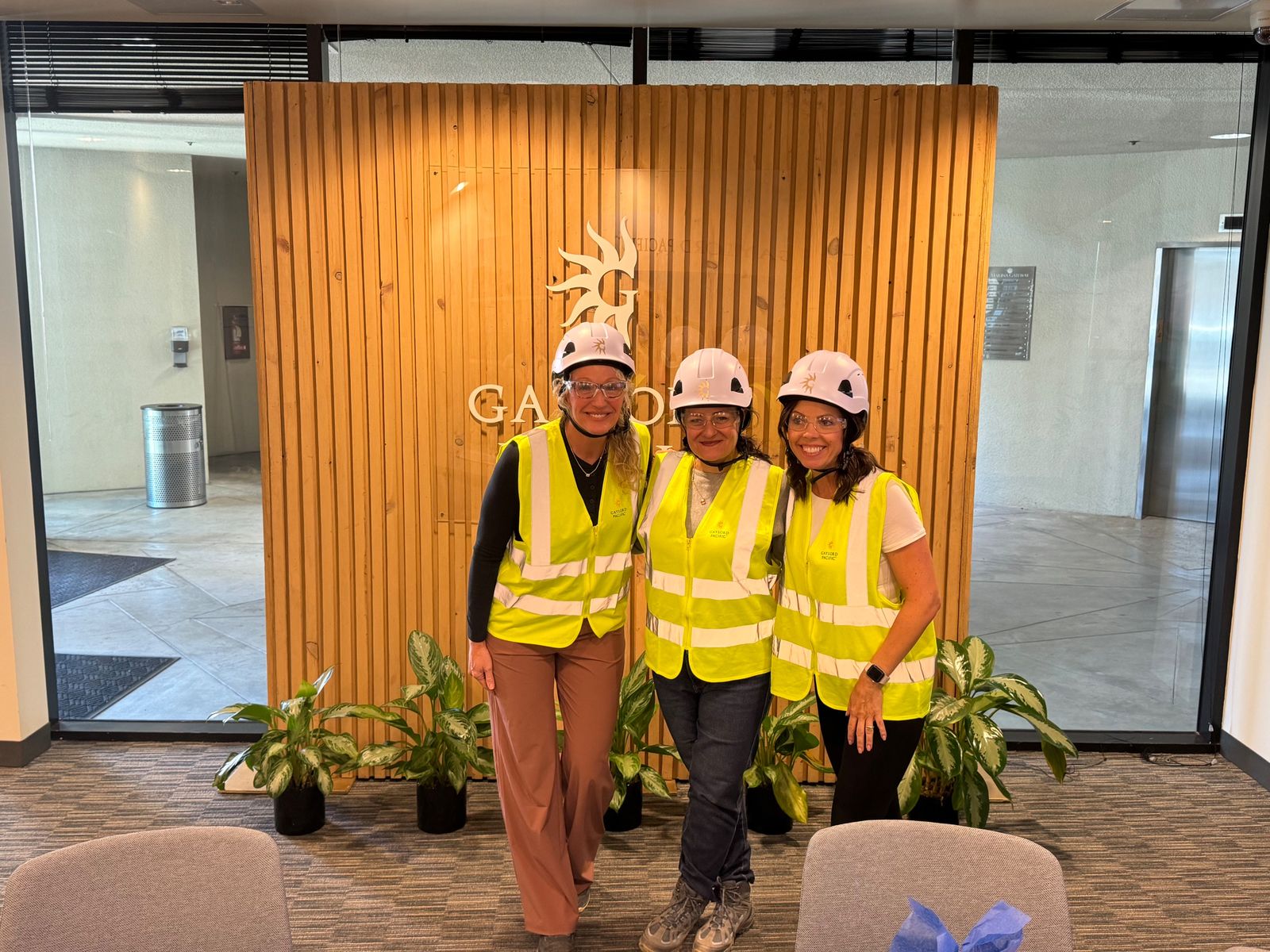 Beth and colleagues in hard hats at Gaylord Pacific